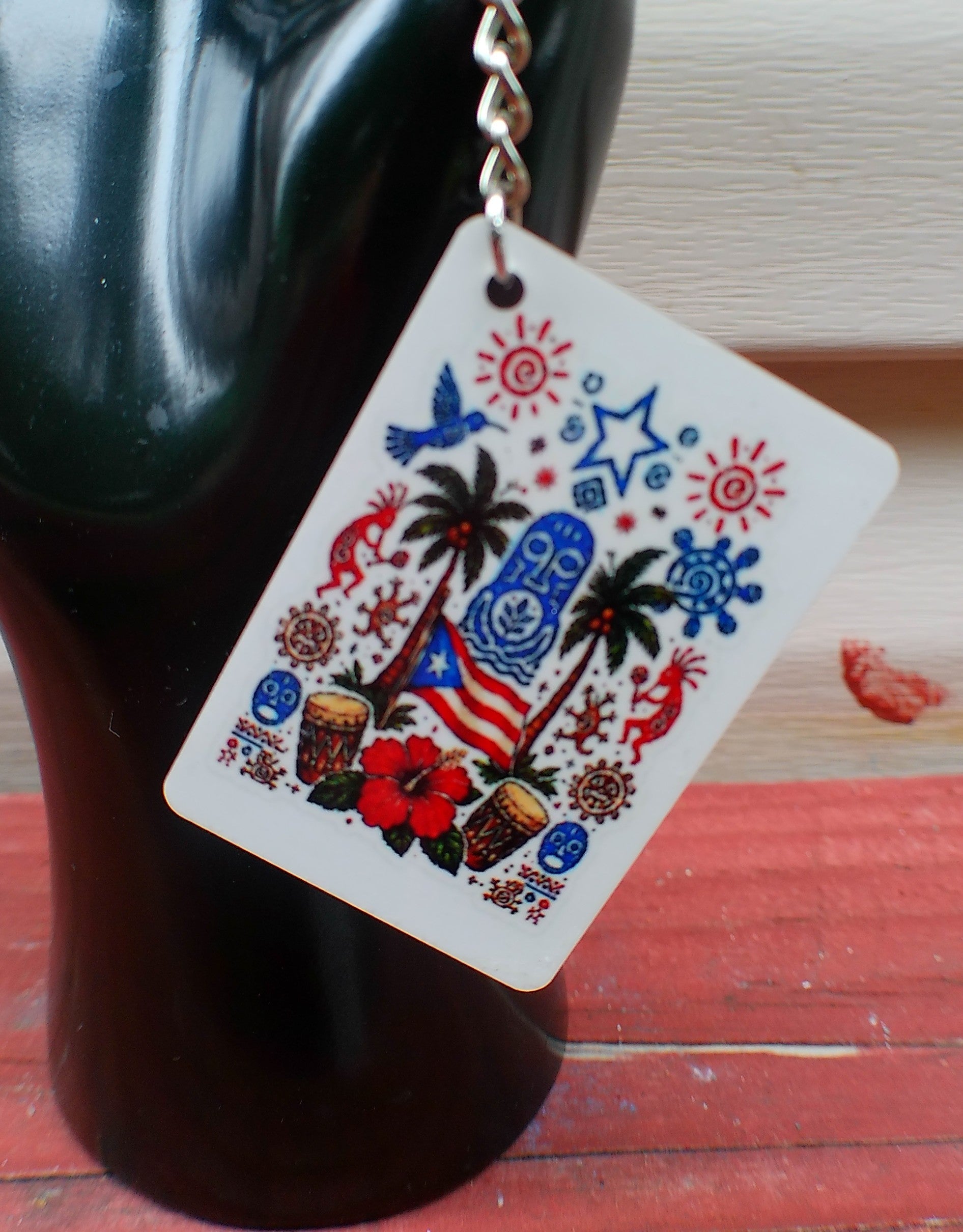 La Mancha del Plátano Boricua keychain - plantain with tropical flowers